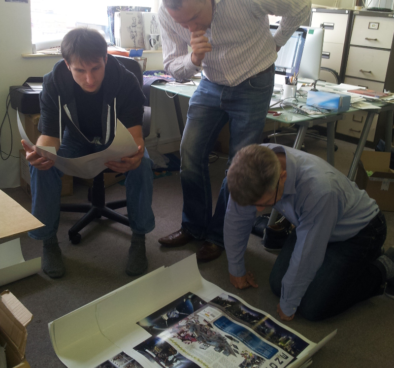 Curis, Mark and Ronnie cast a careful eye over the Deadzone box cover before it goes to print...